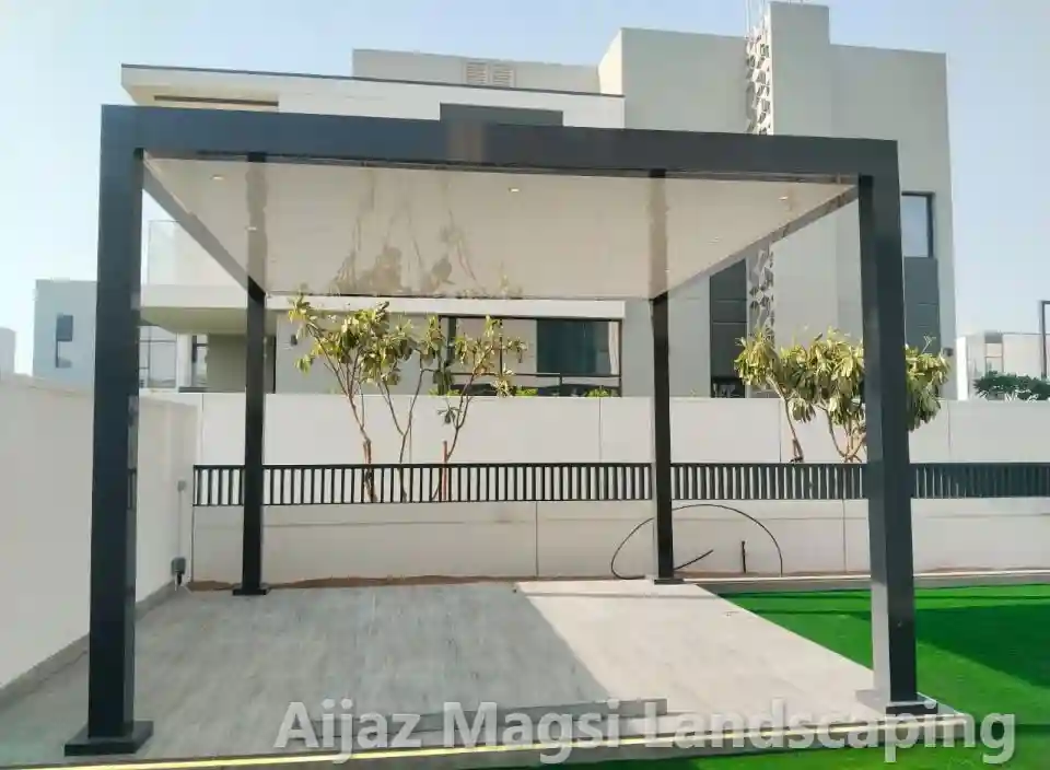 Wooden pergola and gazebo installation with artificial grass lawn in Dubai